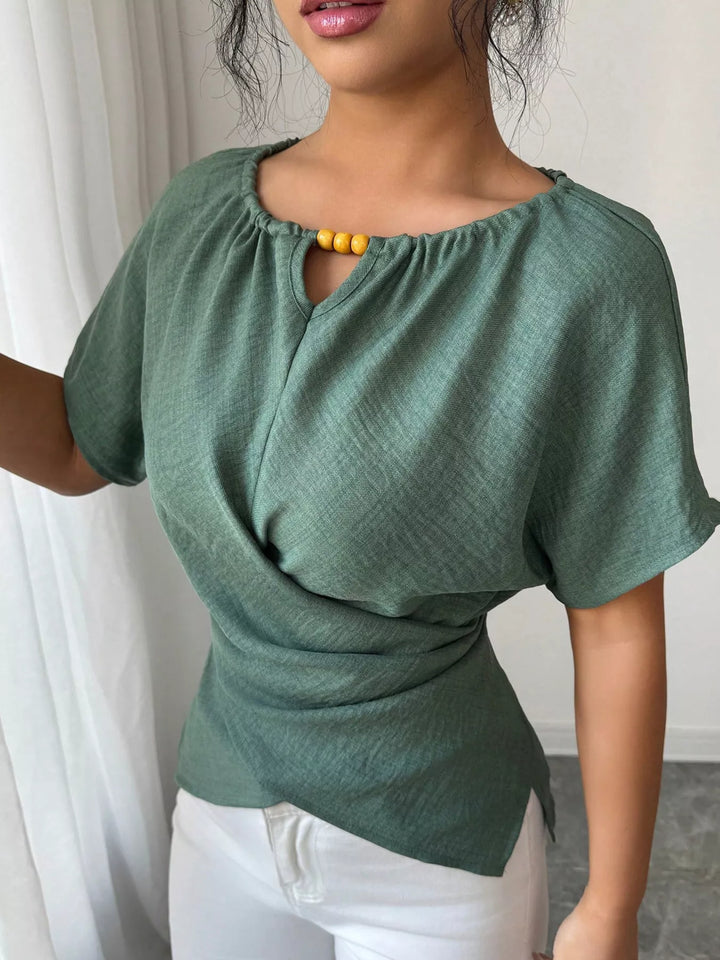 Green Wrap-front short sleeve blouse with beaded keyhole neckline
