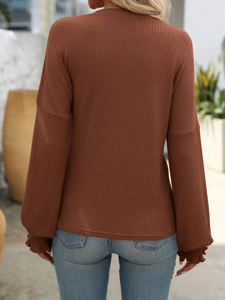 Ribbed knit crew neck top with ruffled smocked cuffs