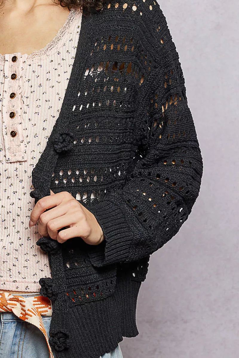 Open-knit cropped cardigan with 3D floral button closure