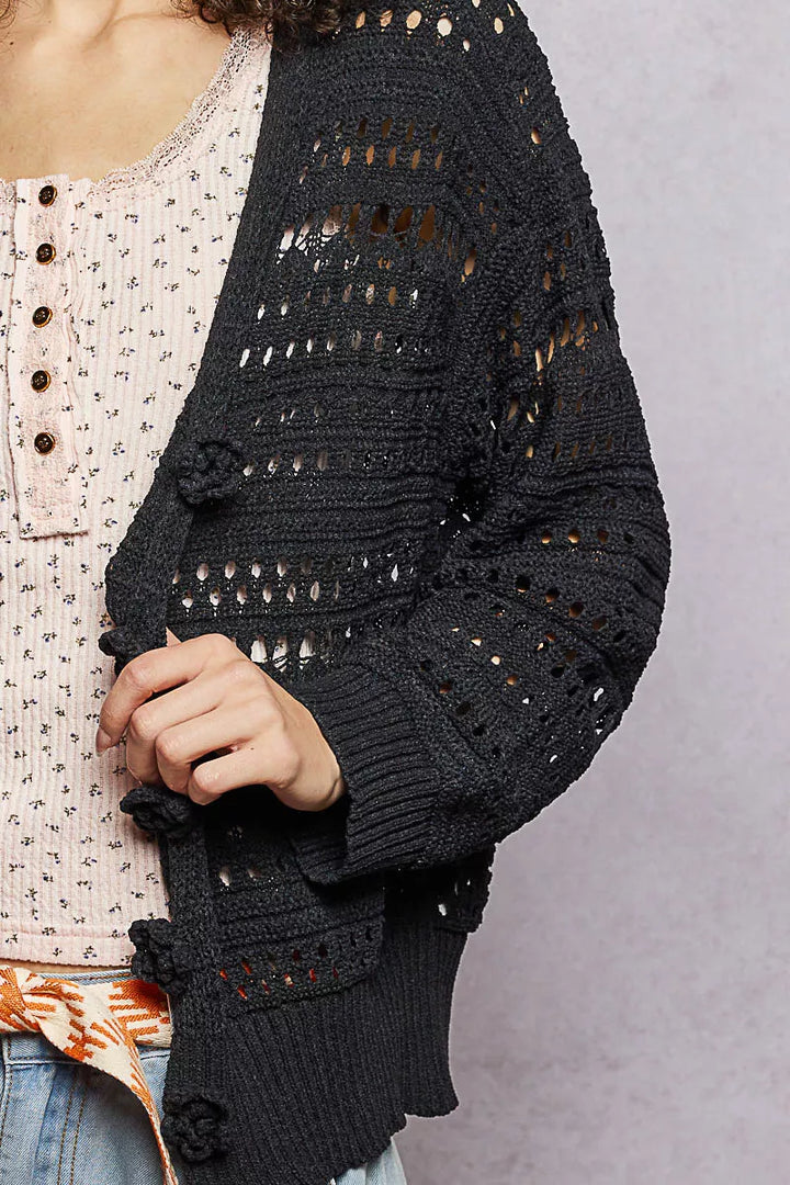 Open-knit cropped cardigan with 3D floral button closure