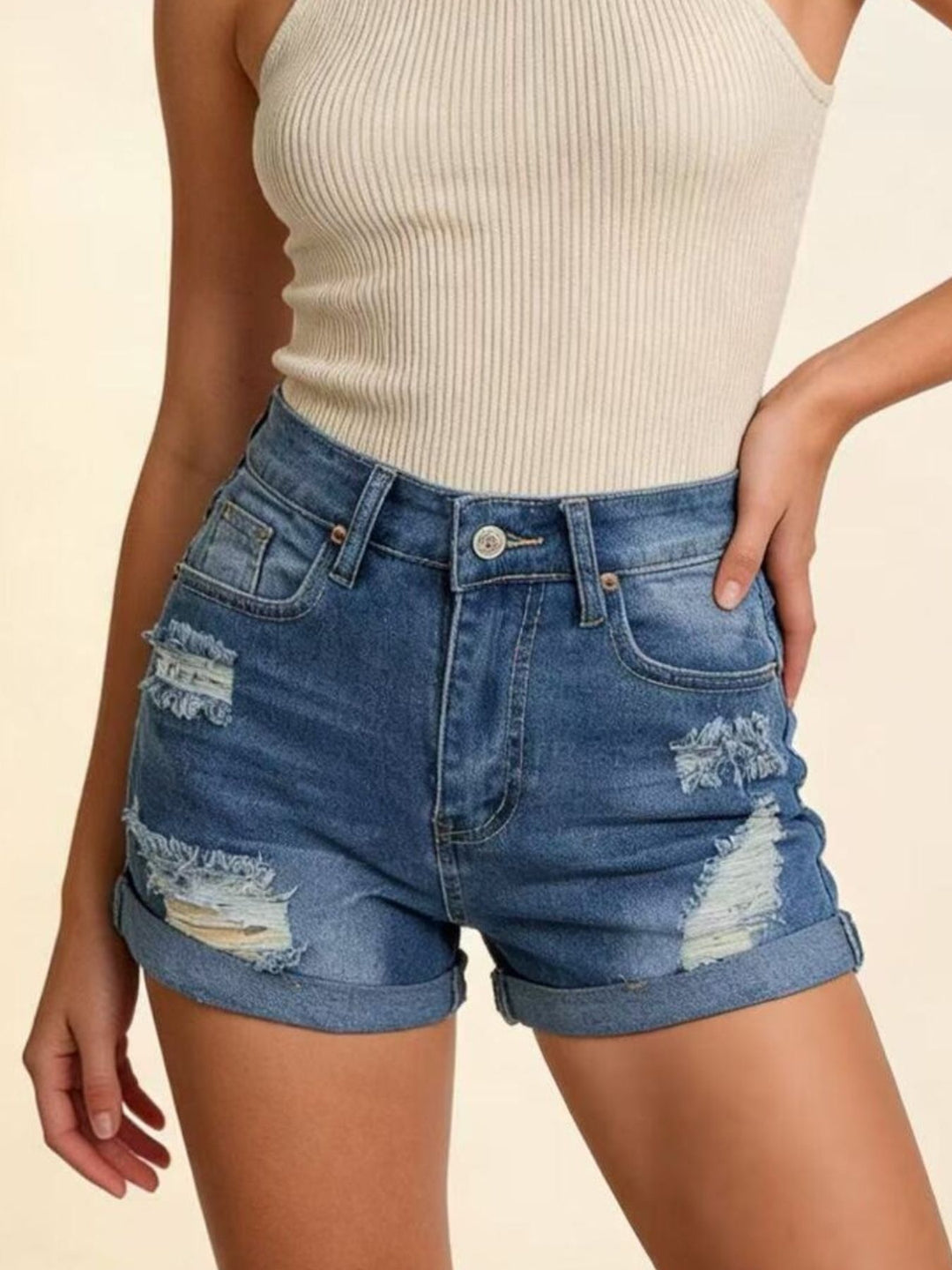 Distressed high-rise denim shorts with cuffed hem