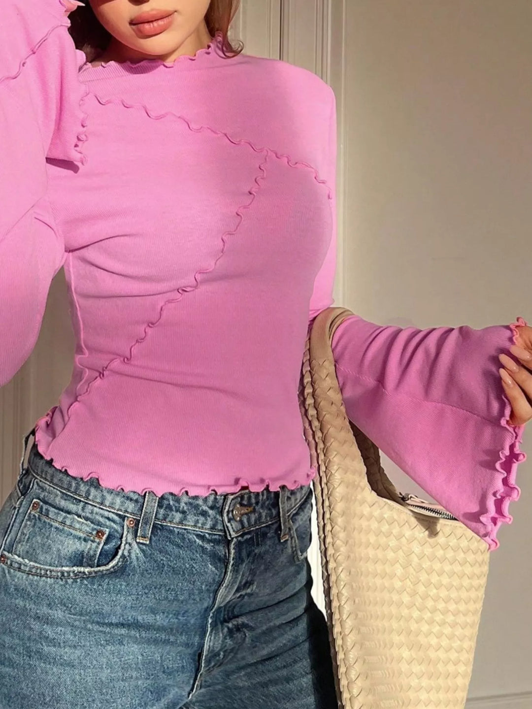Ribbed knit mock neck top with lettuce-edge flare sleeves