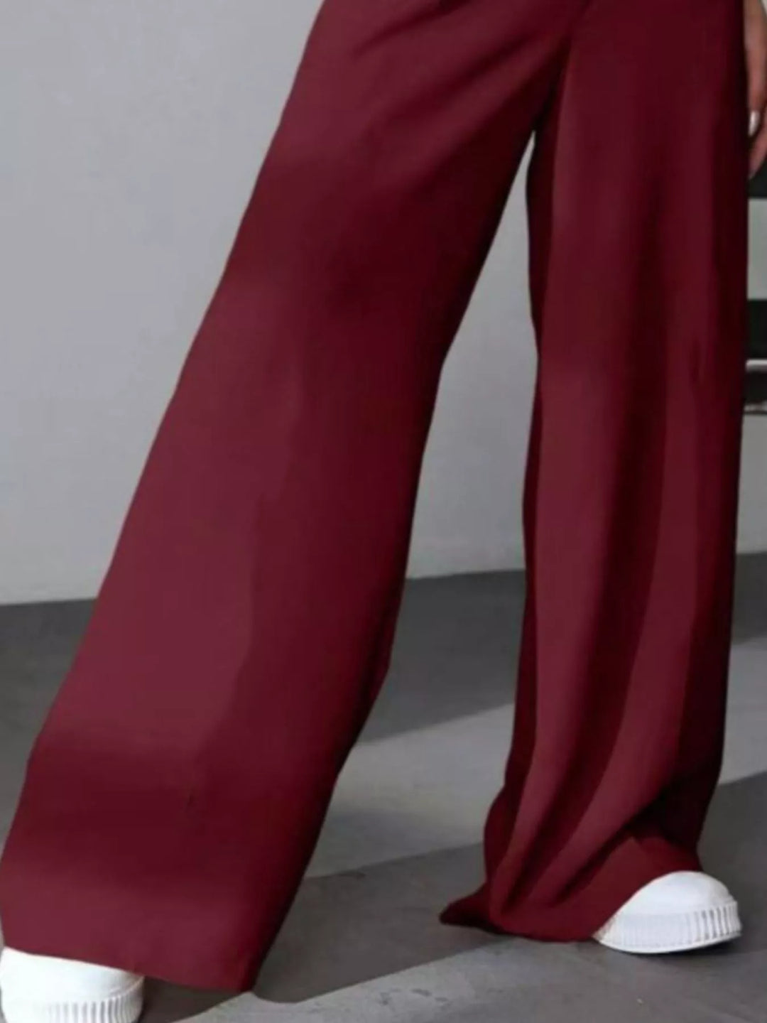 High-rise wide-leg pleated pants with button waist