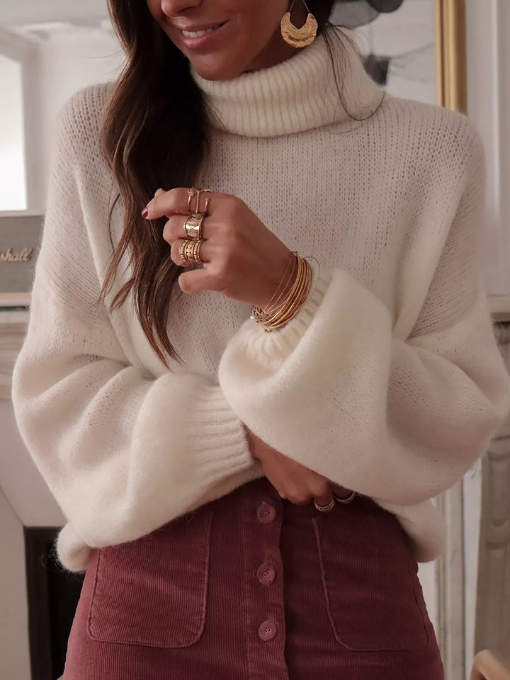 Oversized turtleneck sweater with dropped shoulders and ribbed cuffs