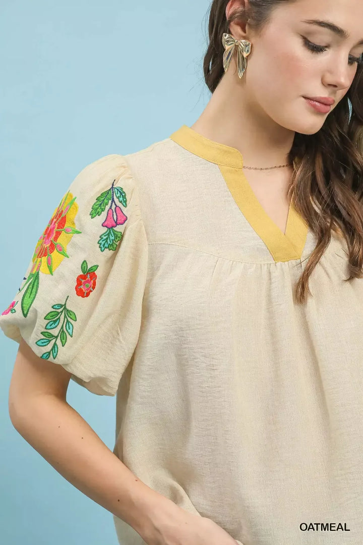 Floral embroidered puff sleeve top with split V-neck