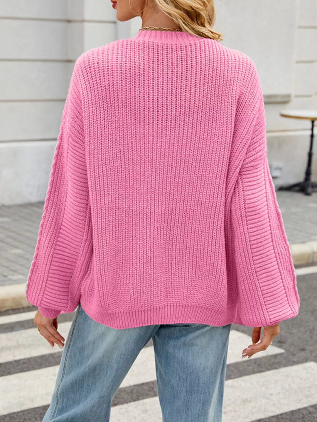 Cable knit button-front cardigan with drop shoulder sleeves