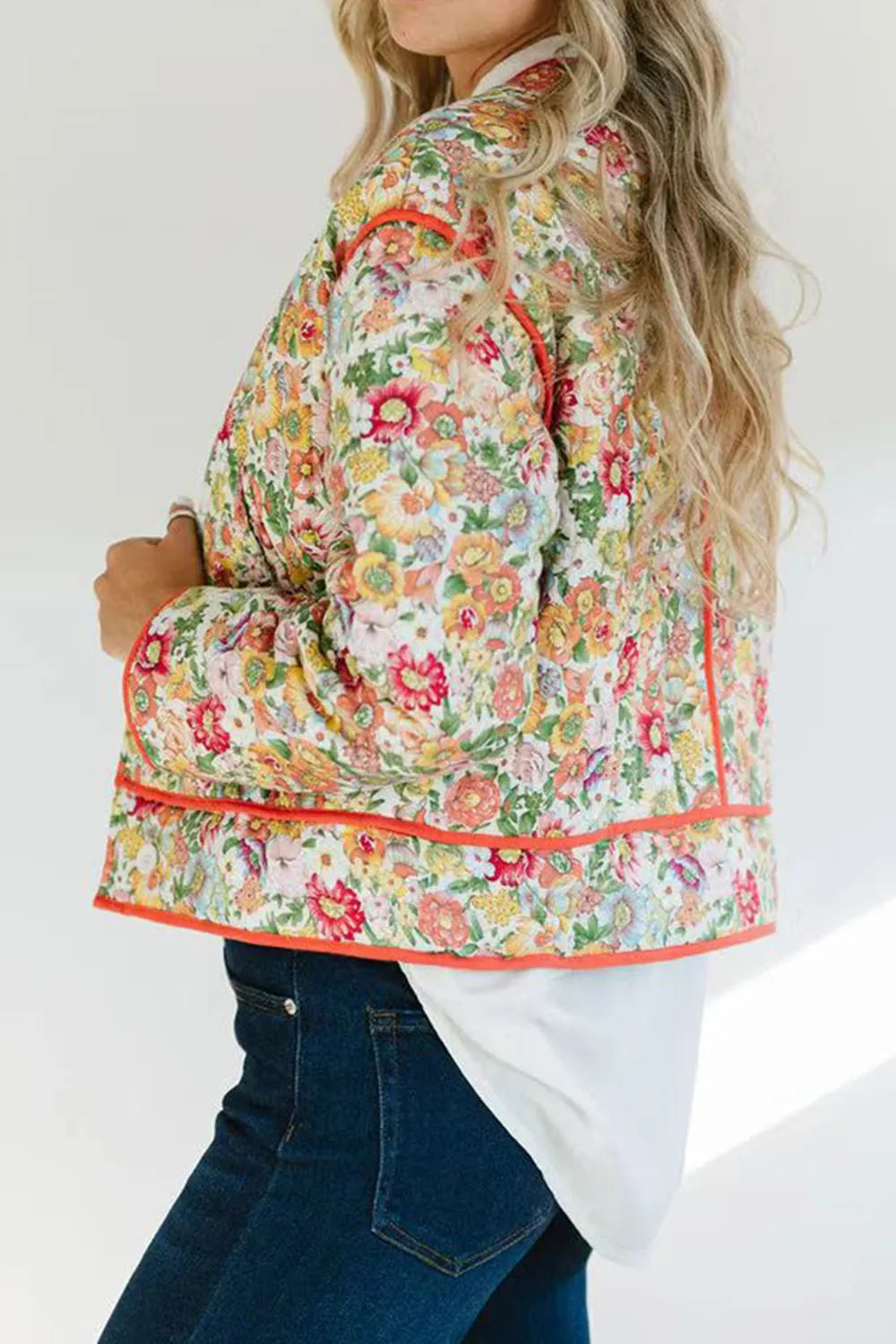 Quilted floral jacket with contrast piped trim and round neck