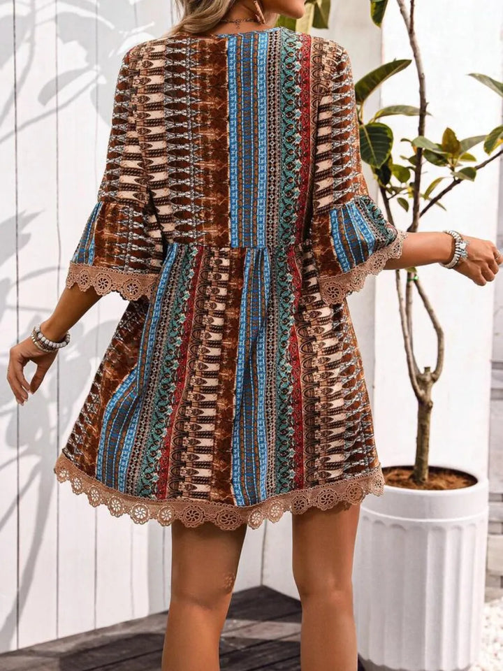 Boho printed mini dress with lace trim and bell sleeves