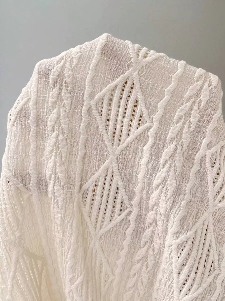 Textured diamond knit round neck top with cap sleeves