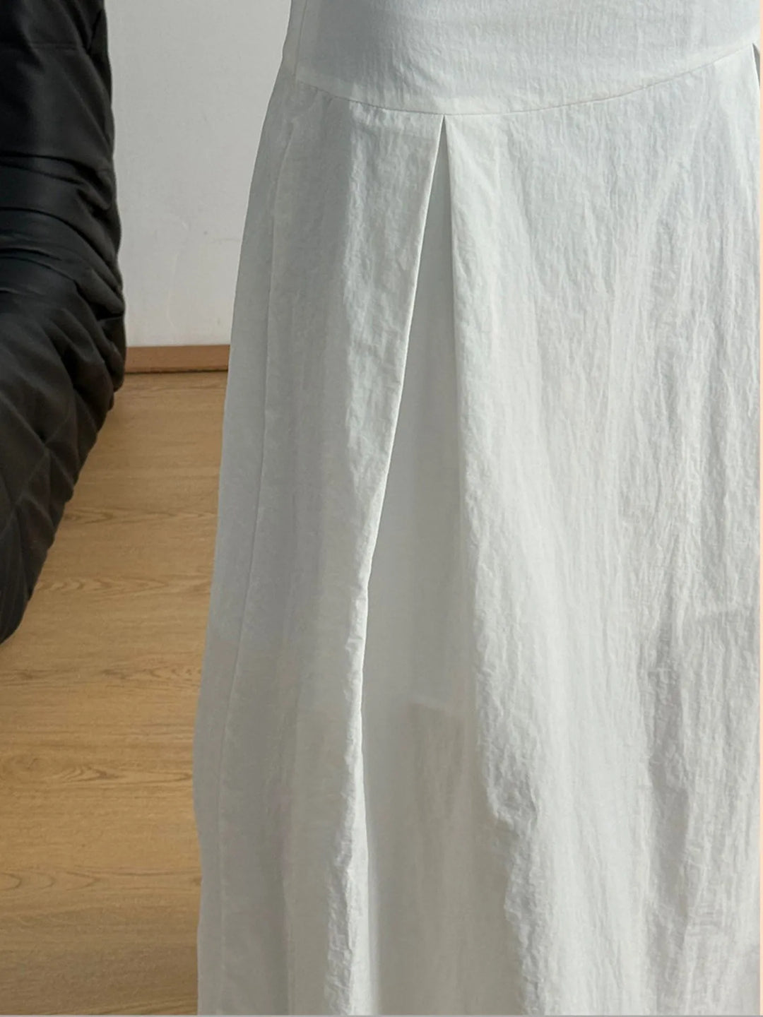 High-rise A-line maxi skirt with front pleats