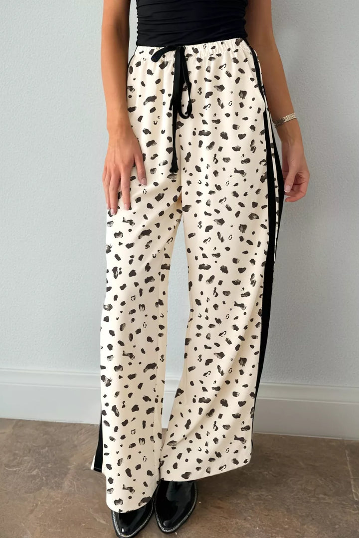 Cream Leopard print wide-leg pants with side stripe and drawstring waist