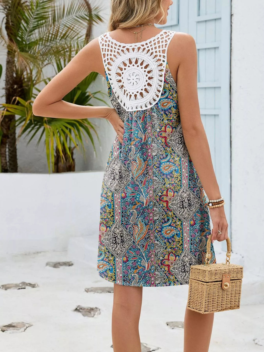 Watercolor floral mini dress with crochet cutout back