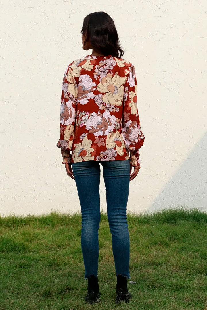 Floral lantern sleeve v-neck blouse with smocked cuffs