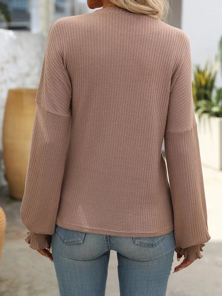 Ribbed knit crew neck top with ruffled smocked cuffs