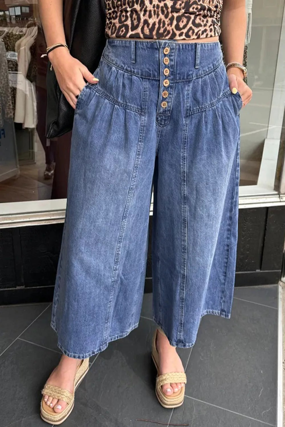 High-rise wide-leg button-fly jeans with pleated waist