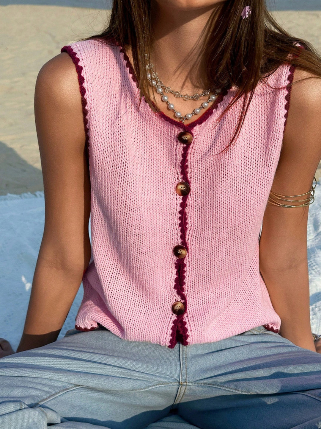 Button-front knit sweater vest with contrast whipstitch trim