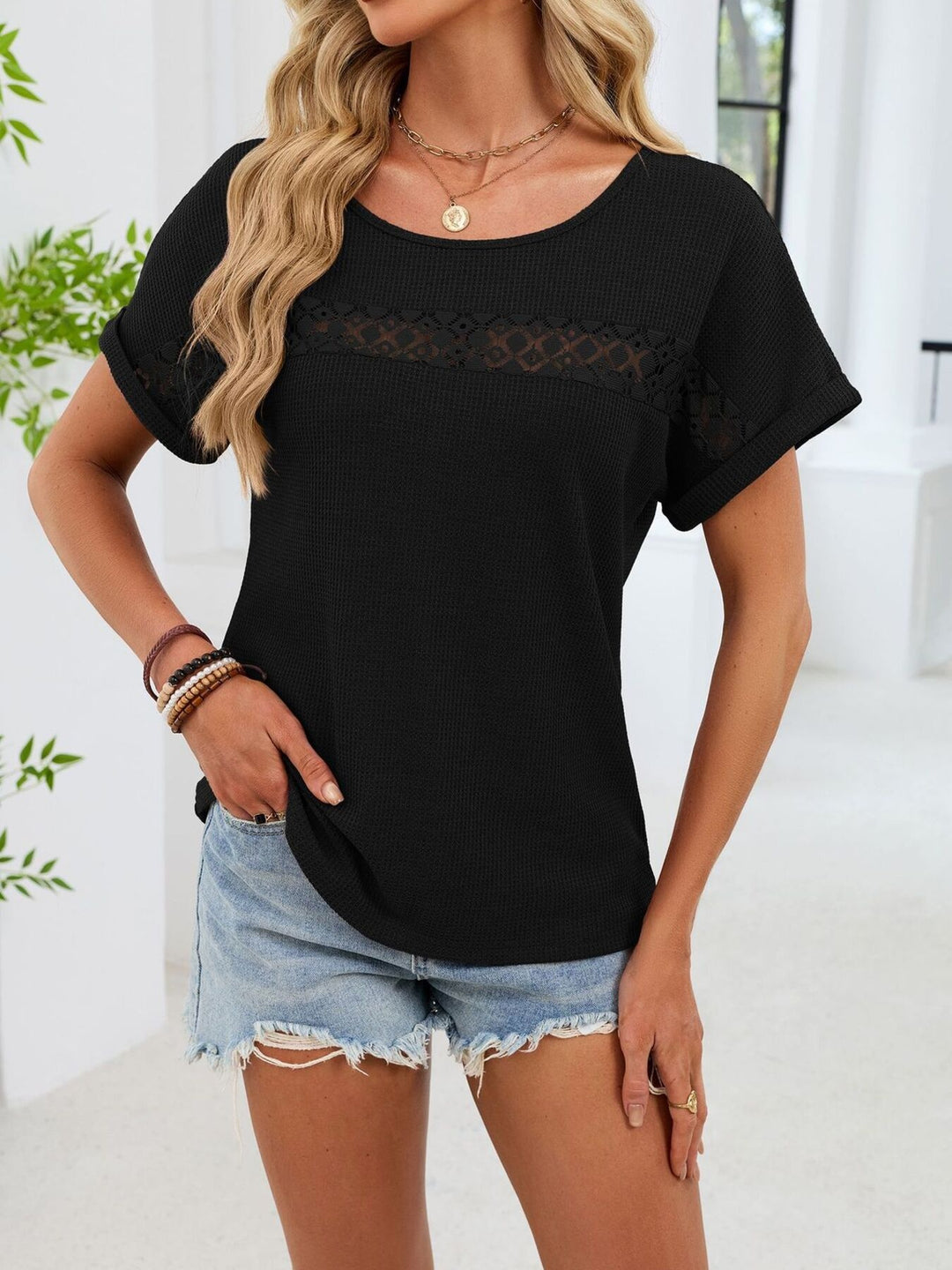 Waffle knit top with lace inset yoke and cuffed sleeves