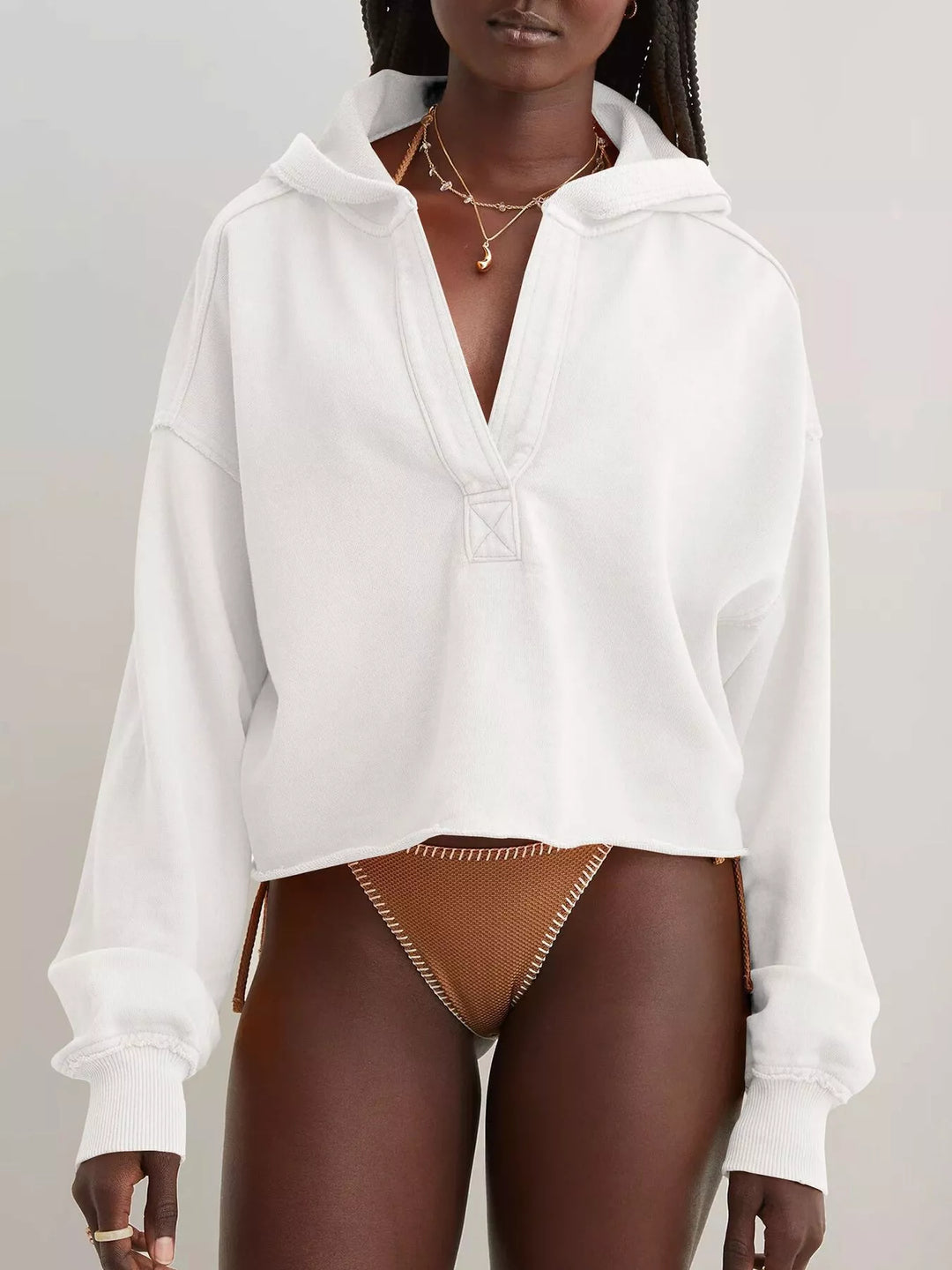 Cropped exposed-seam pullover hoodie with split neck