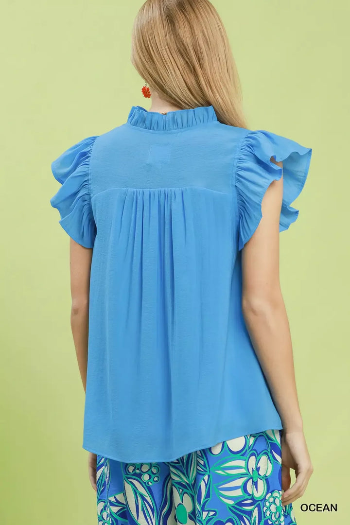 Smocked yoke flutter sleeve blouse with ruffle placket
