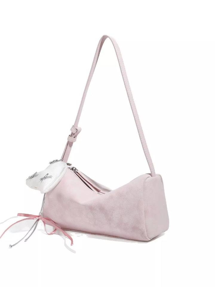 Adjustable strap crossbody bag with heart charm and bow trim