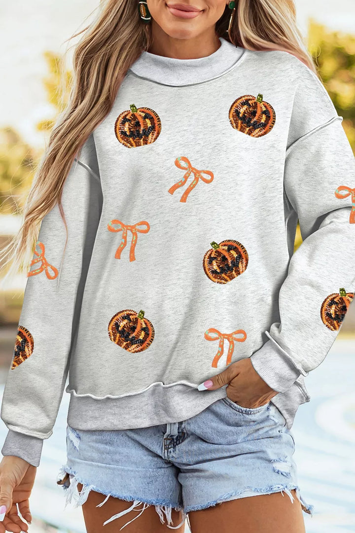 Sequin pumpkin and bow exposed seam Halloween sweatshirt