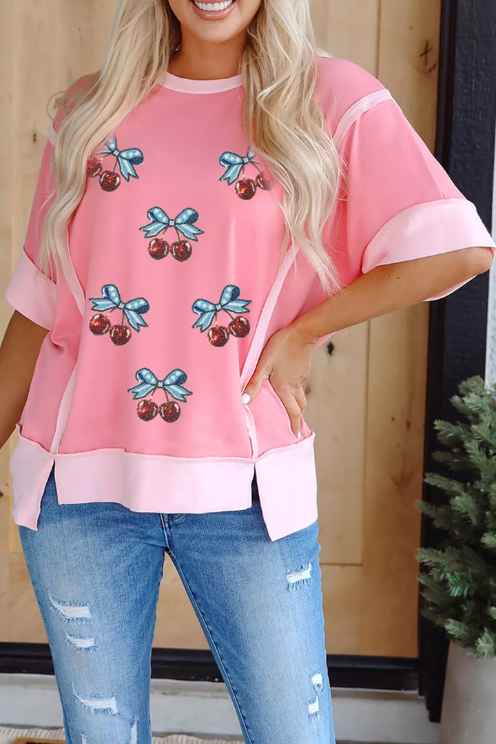Sequin cherry and bow graphic raw seam crew neck top