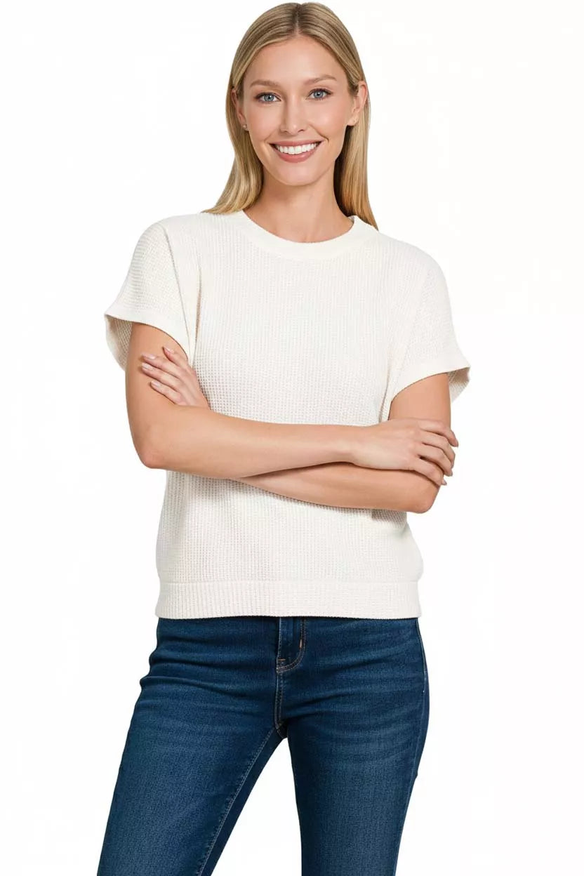 Waffle knit short sleeve sweater with banded hem
