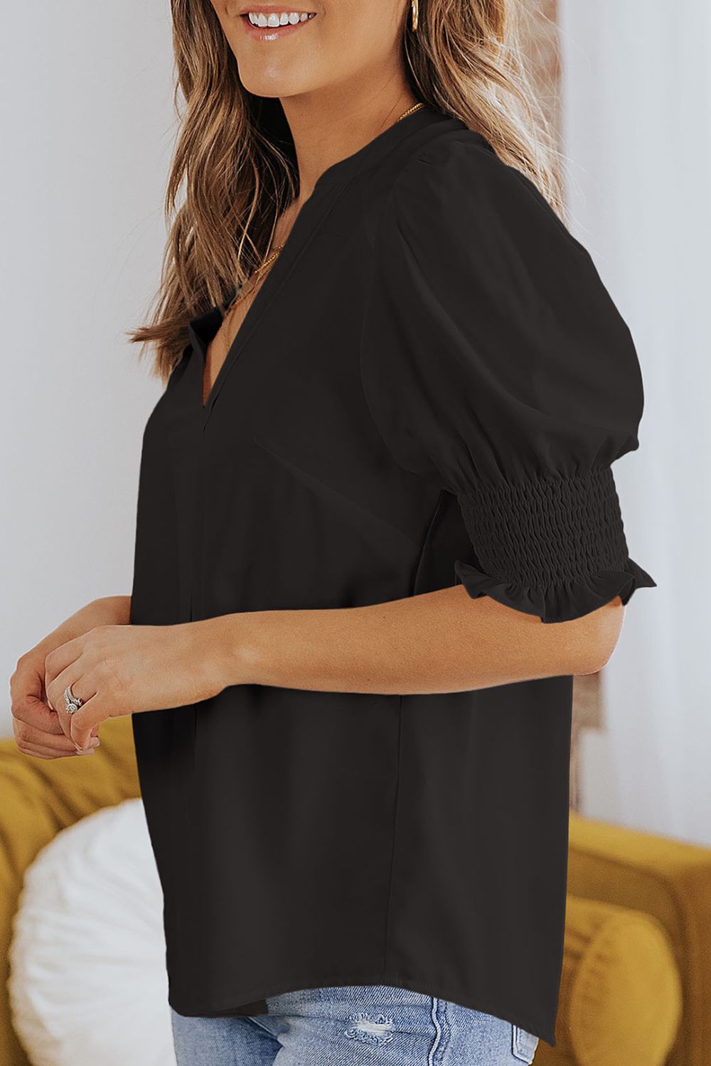 Notched neck blouse with smocked flounce sleeves