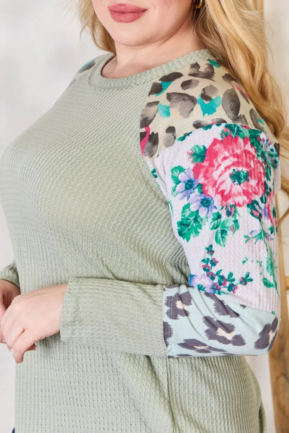 Waffle knit top with floral and leopard print sleeves