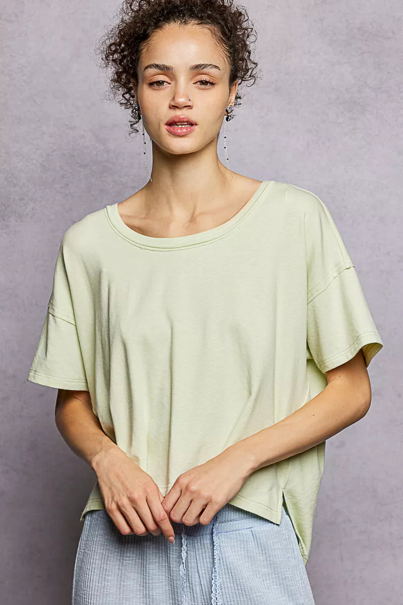 Relaxed short sleeve tee with high-low hem and exposed seams