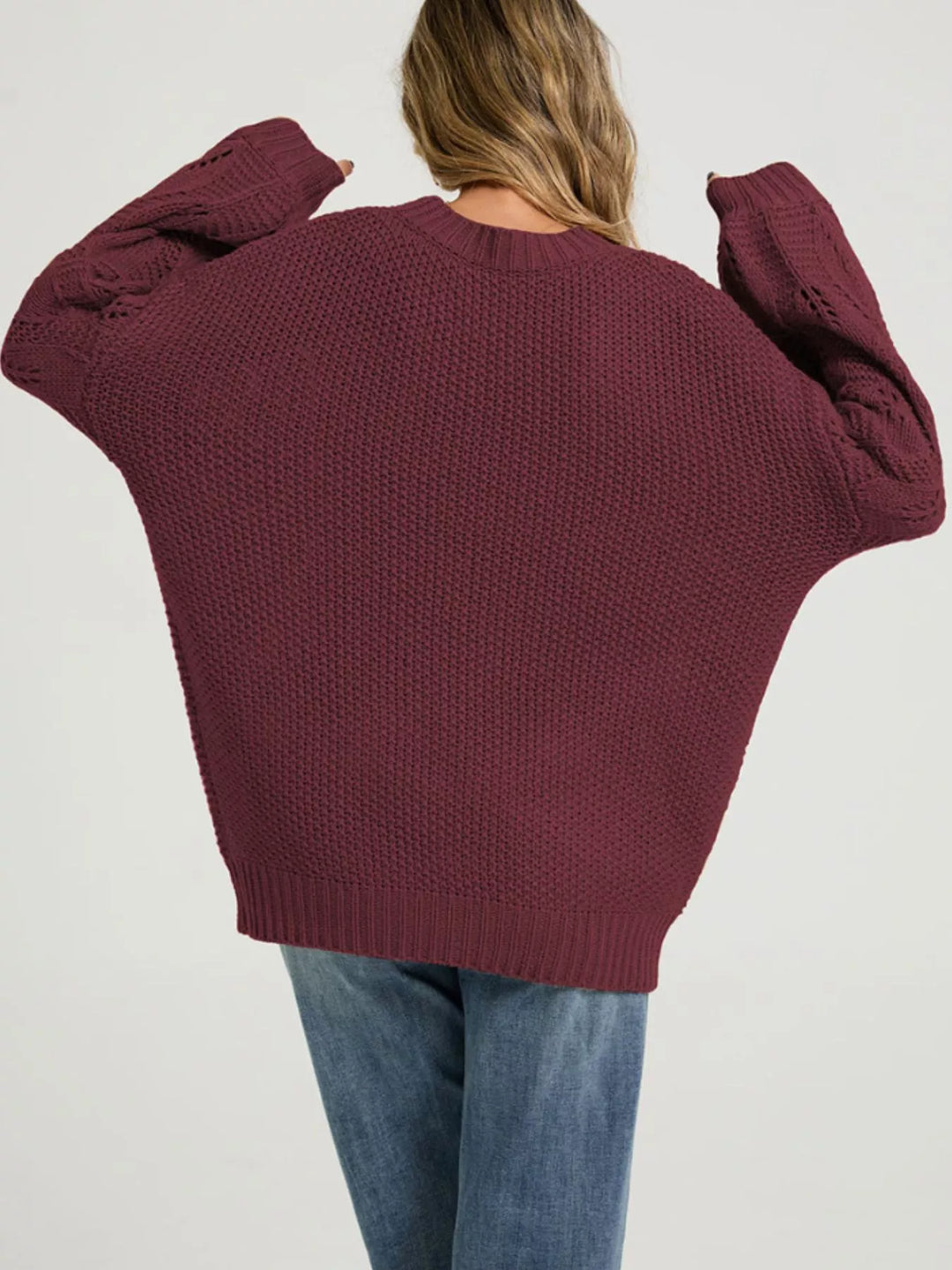 Openwork knit dropped shoulder sweater with curved hem
