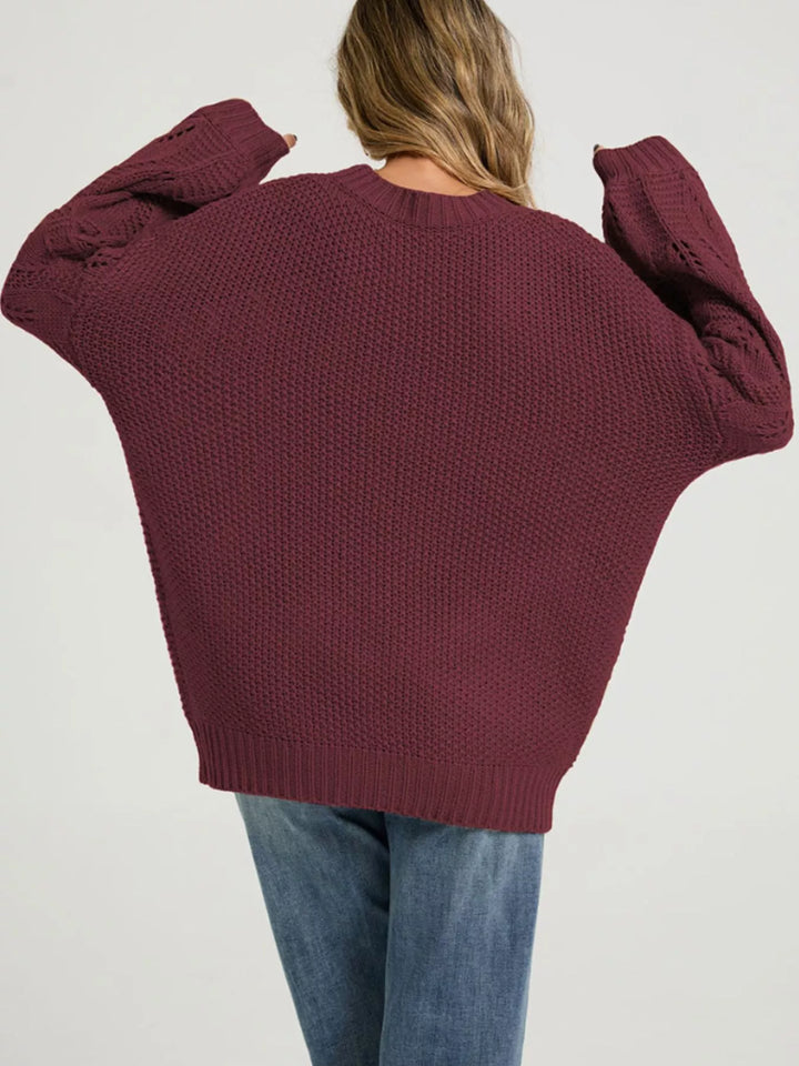 Openwork knit dropped shoulder sweater with curved hem