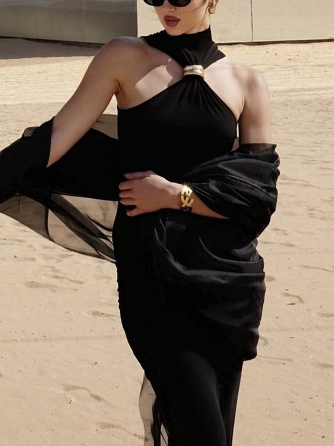 Sleeveless turtleneck tank with gold ring cutout detail