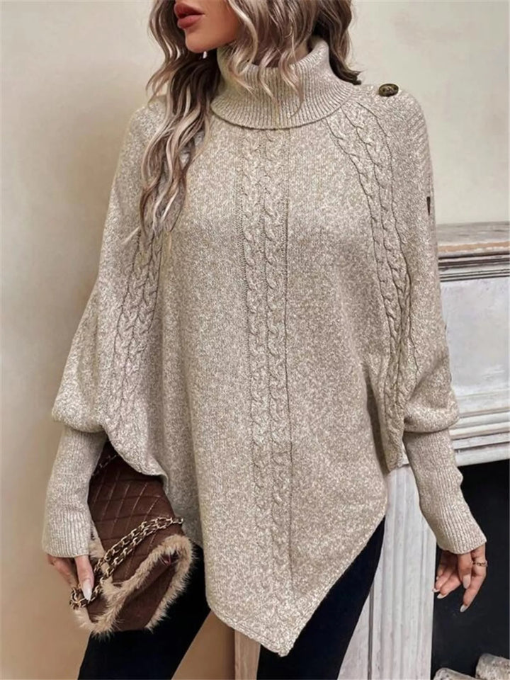 Cable knit turtleneck cape sweater with button shoulder
