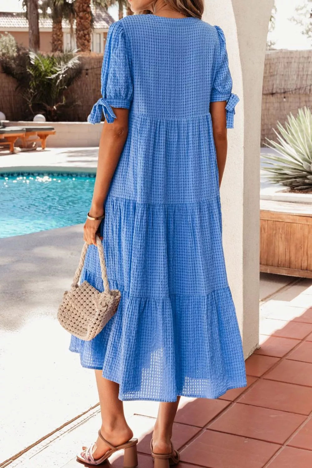Tiered midi dress with notched neckline and tie sleeves