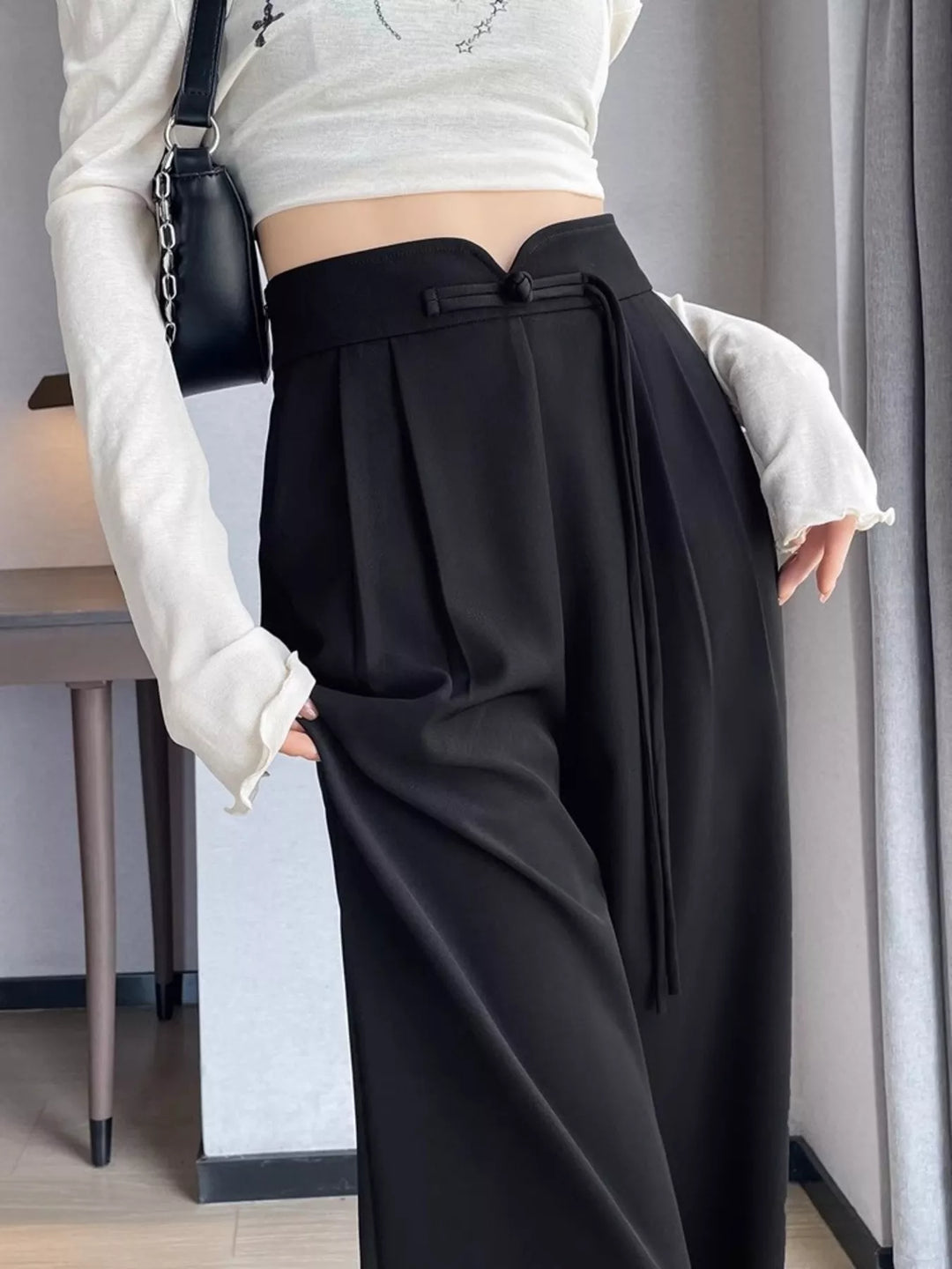 High-rise wide-leg pants with pleated front and tie waist