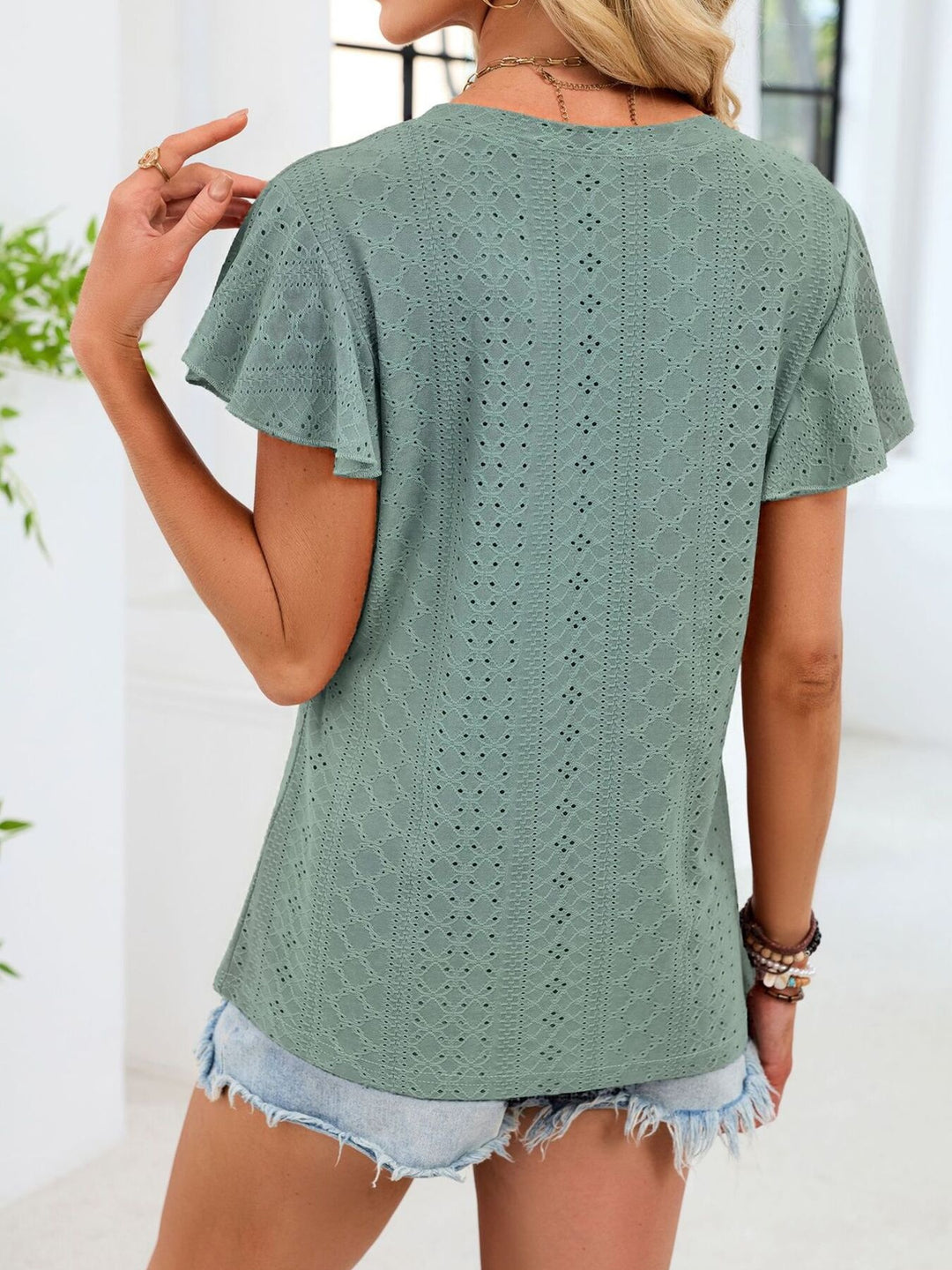 Eyelet flutter sleeve V-neck top with ruched neckline