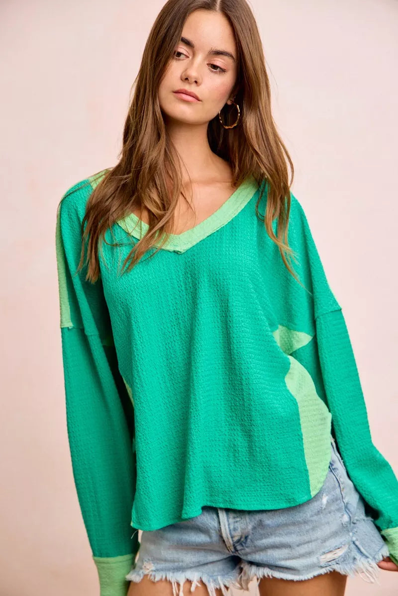 Color block long sleeve textured jersey top with raw-cut edges