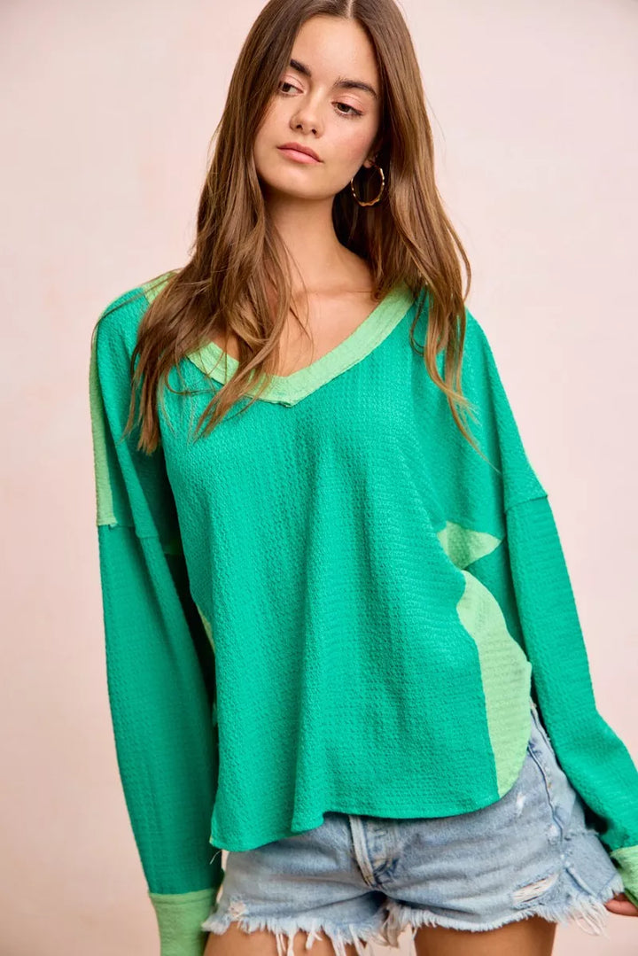 Color block long sleeve textured jersey top with raw-cut edges