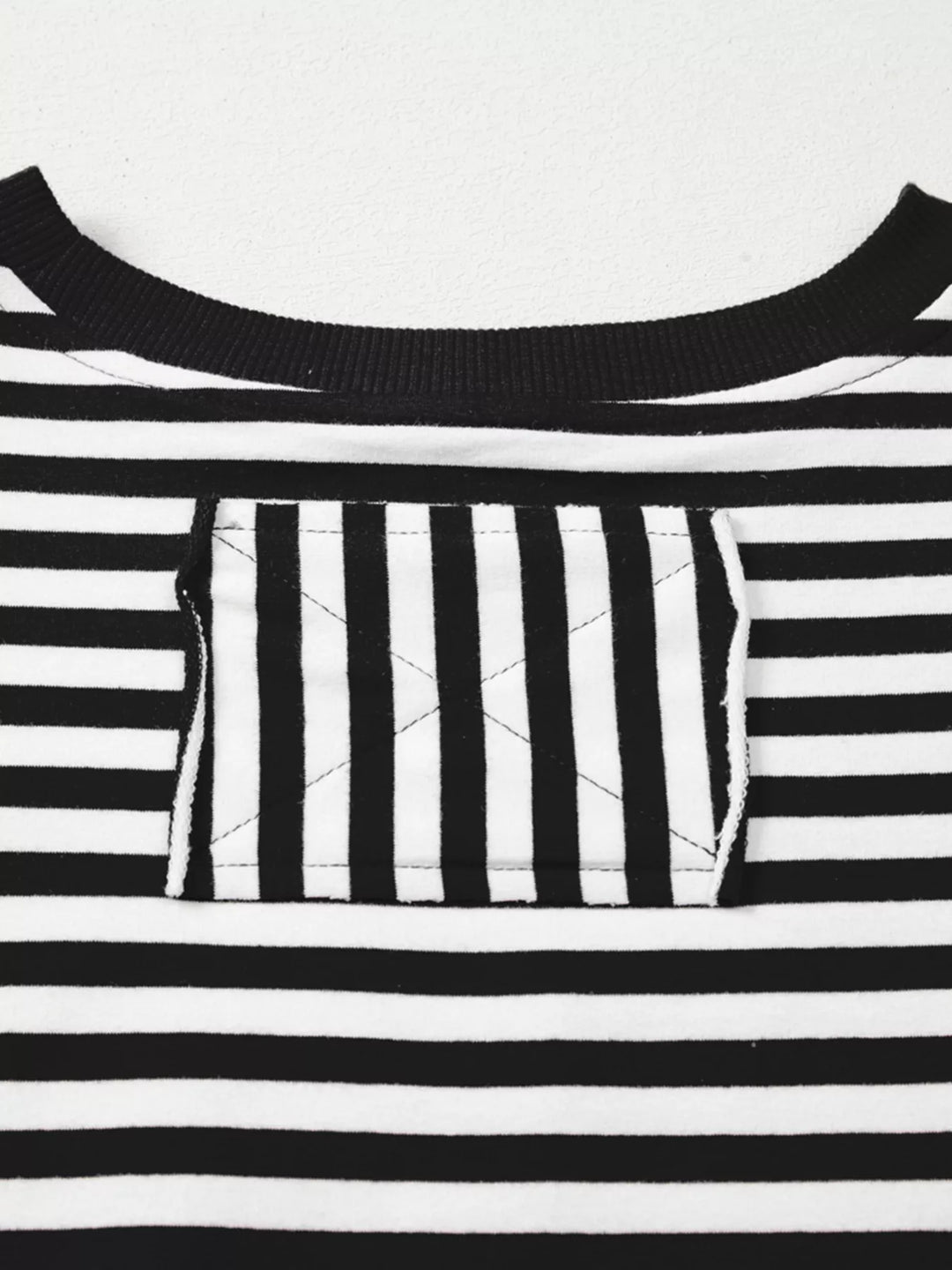 Exposed seam striped drop-shoulder pullover top