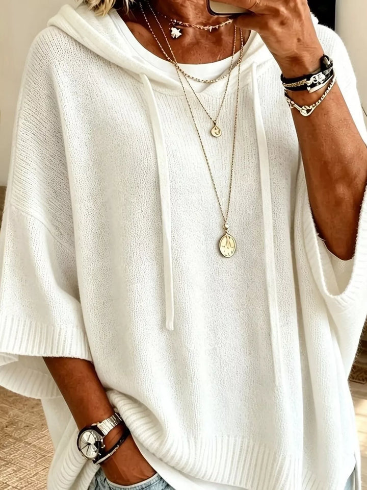 Oversized hooded sweater with drawstring and ribbed trim