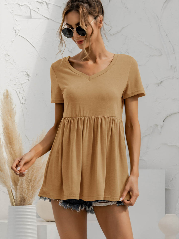 V-neck babydoll top with short sleeves and empire waist