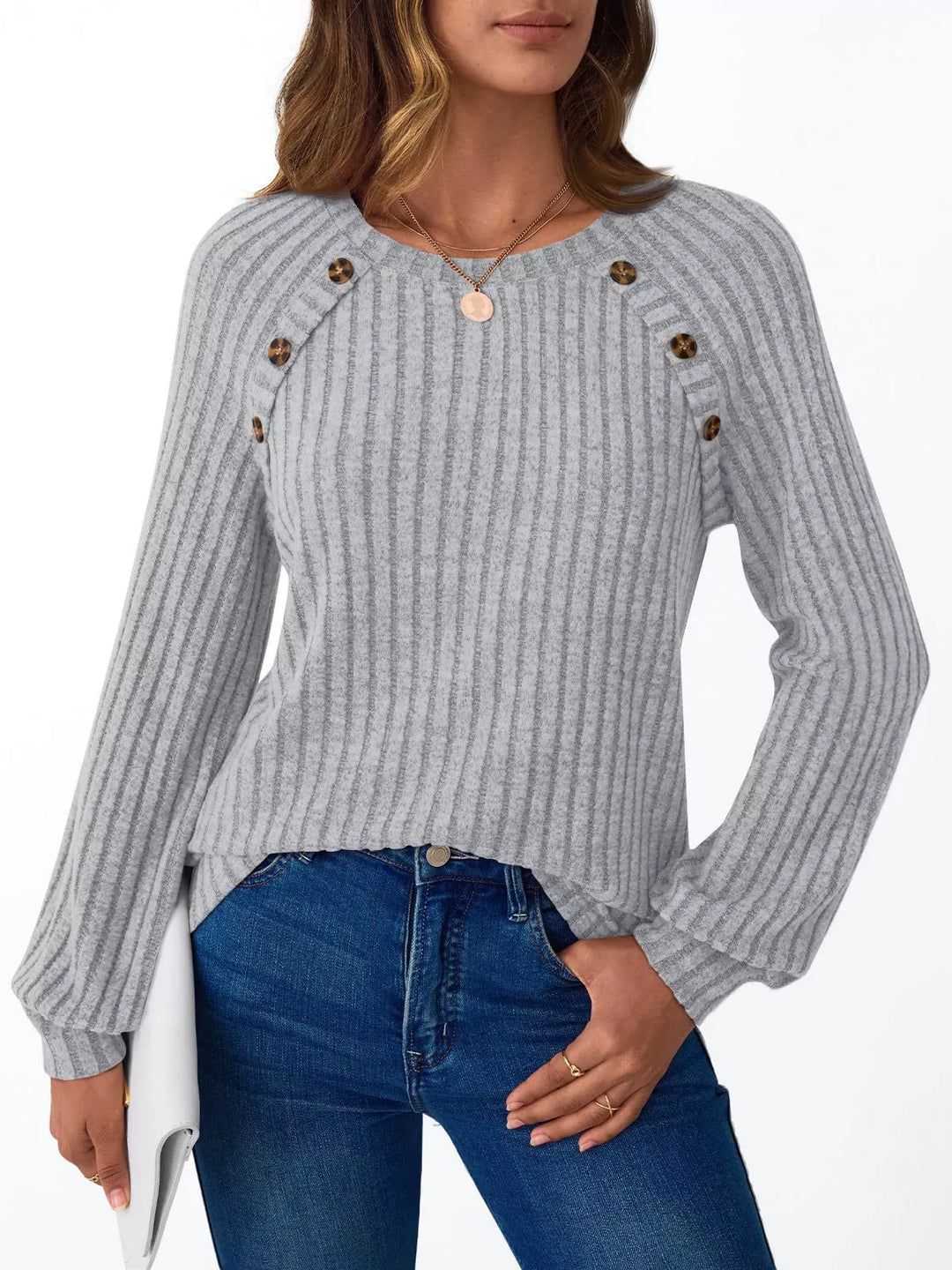 Ribbed knit long sleeve top with decorative shoulder buttons