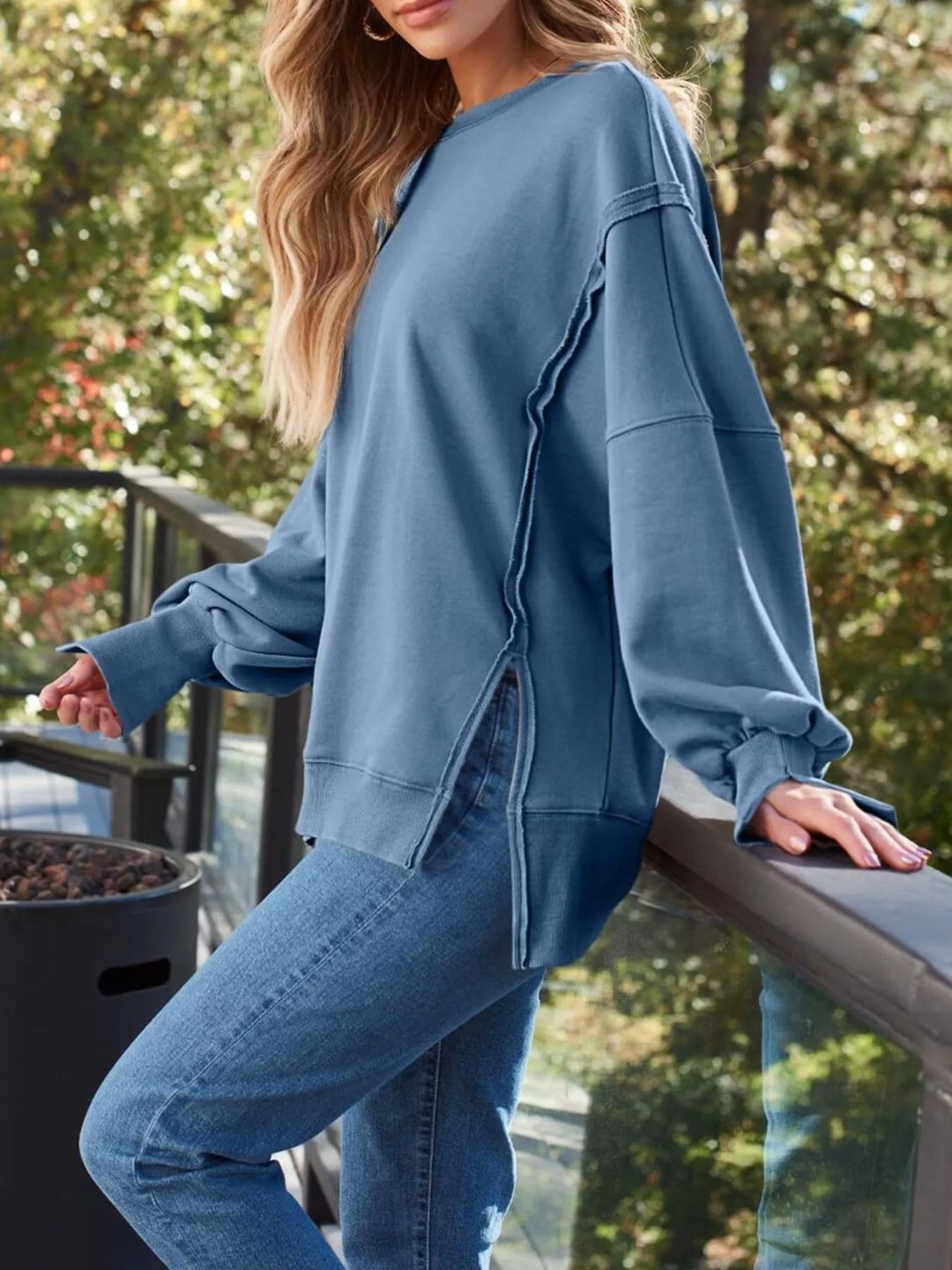 Oversized side-slit sweatshirt with exposed seams
