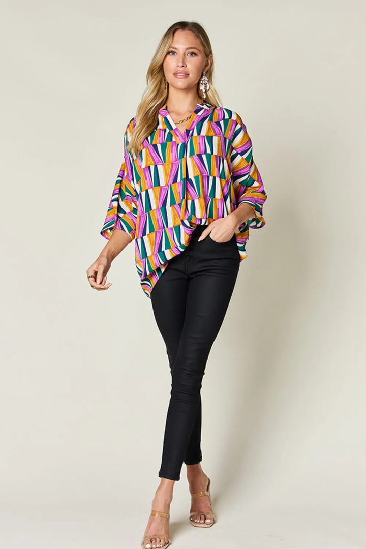 Geometric print notched neck dolman sleeve top