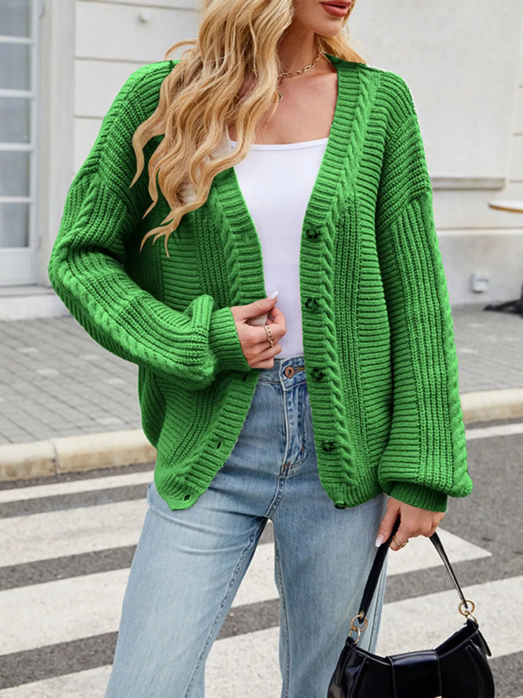 Cable knit button-front cardigan with drop shoulder sleeves
