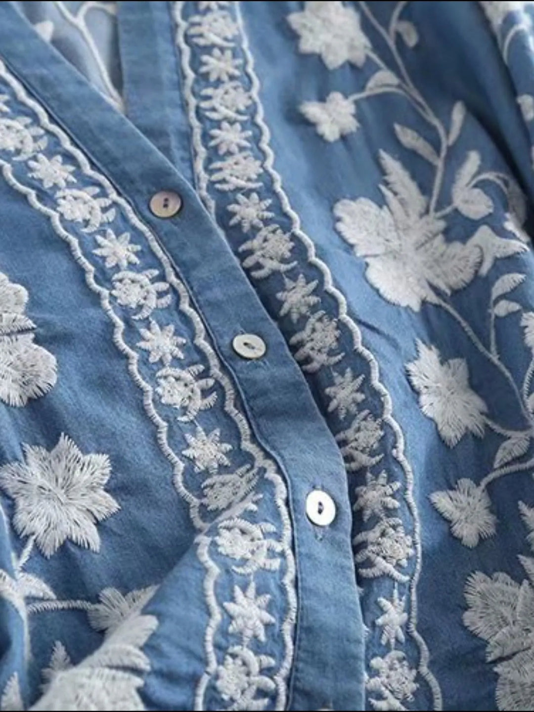 Floral embroidered button-up denim shirt