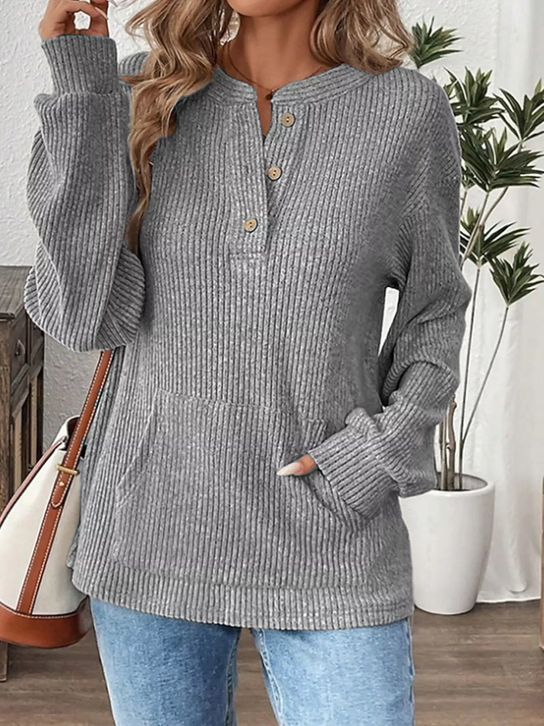 Ribbed knit long sleeve henley top with button placket