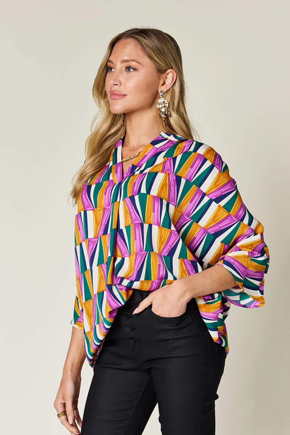 Geometric print notched neck dolman sleeve top