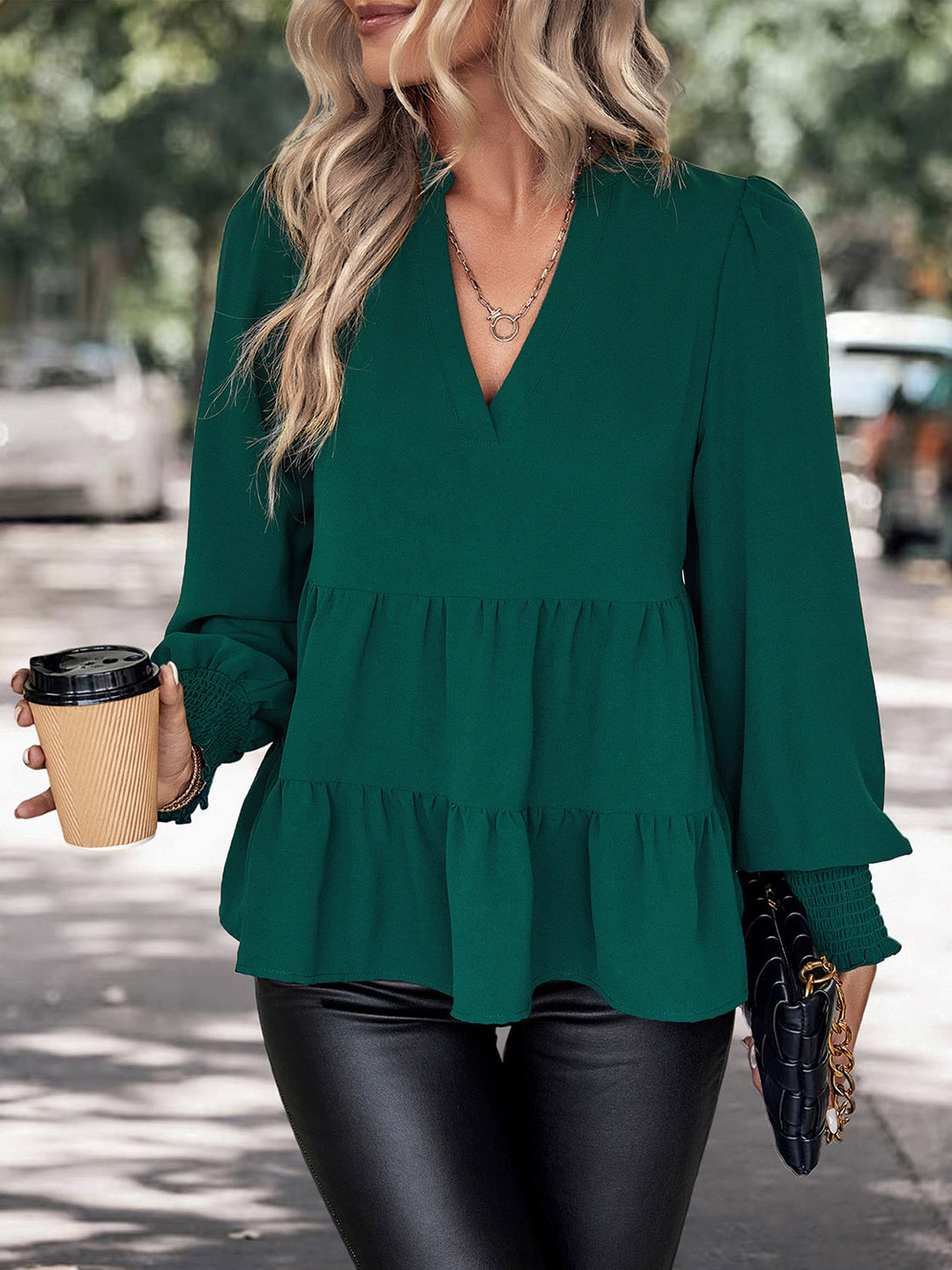 Tiered peplum blouse with notched neck and lantern sleeves